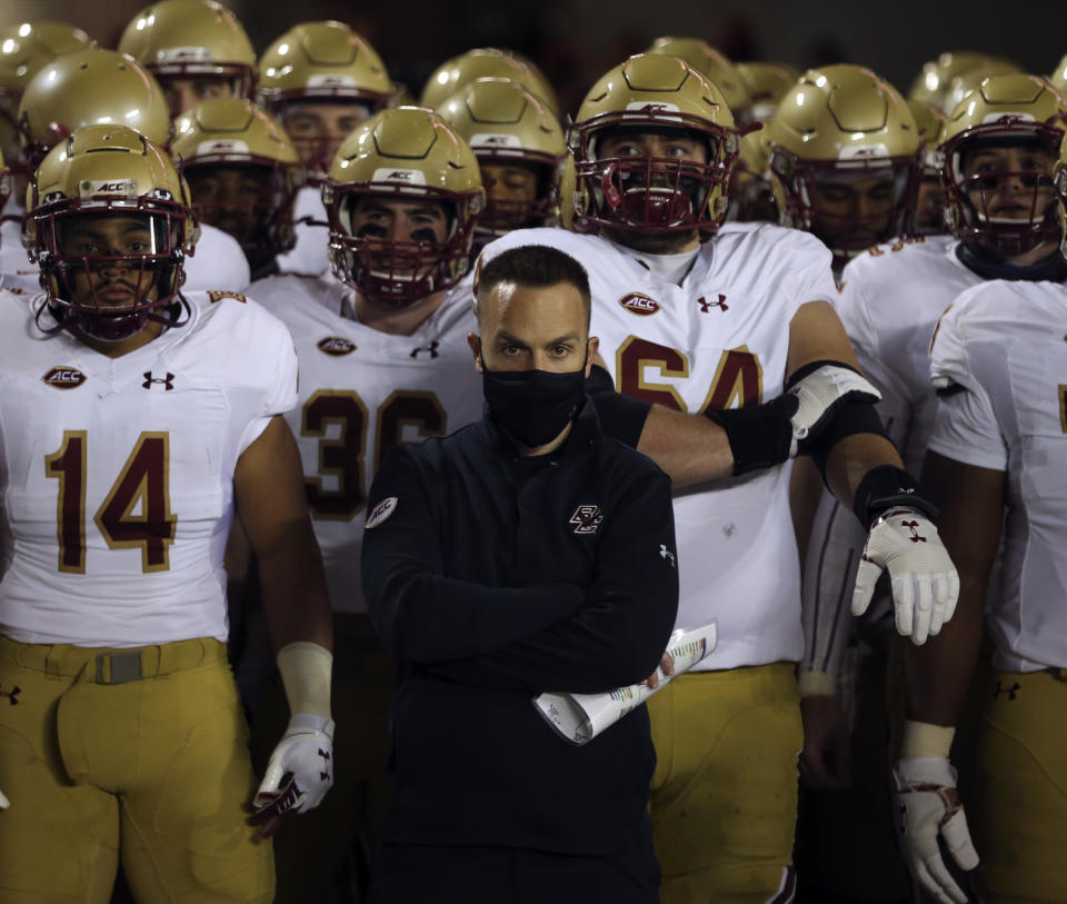 Boston College head coach Jeff Hafley and his team wait to take the field at the start of the first half of an NCAA college football game against Virginia Tech in Blacksburg Va. Saturday, Oct. 17, 2020. (Matt Gentry/The Roanoke Times via AP, Pool)