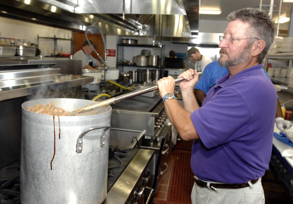 Jerry Mistretta stirs around and checks on the Cajun pork roast stew while his kitchen staff prepares for the massive lunch crowd Thursday, Oct. 4, 2007, for the re-opening of the restaurant after it was closed following a fire in February.
