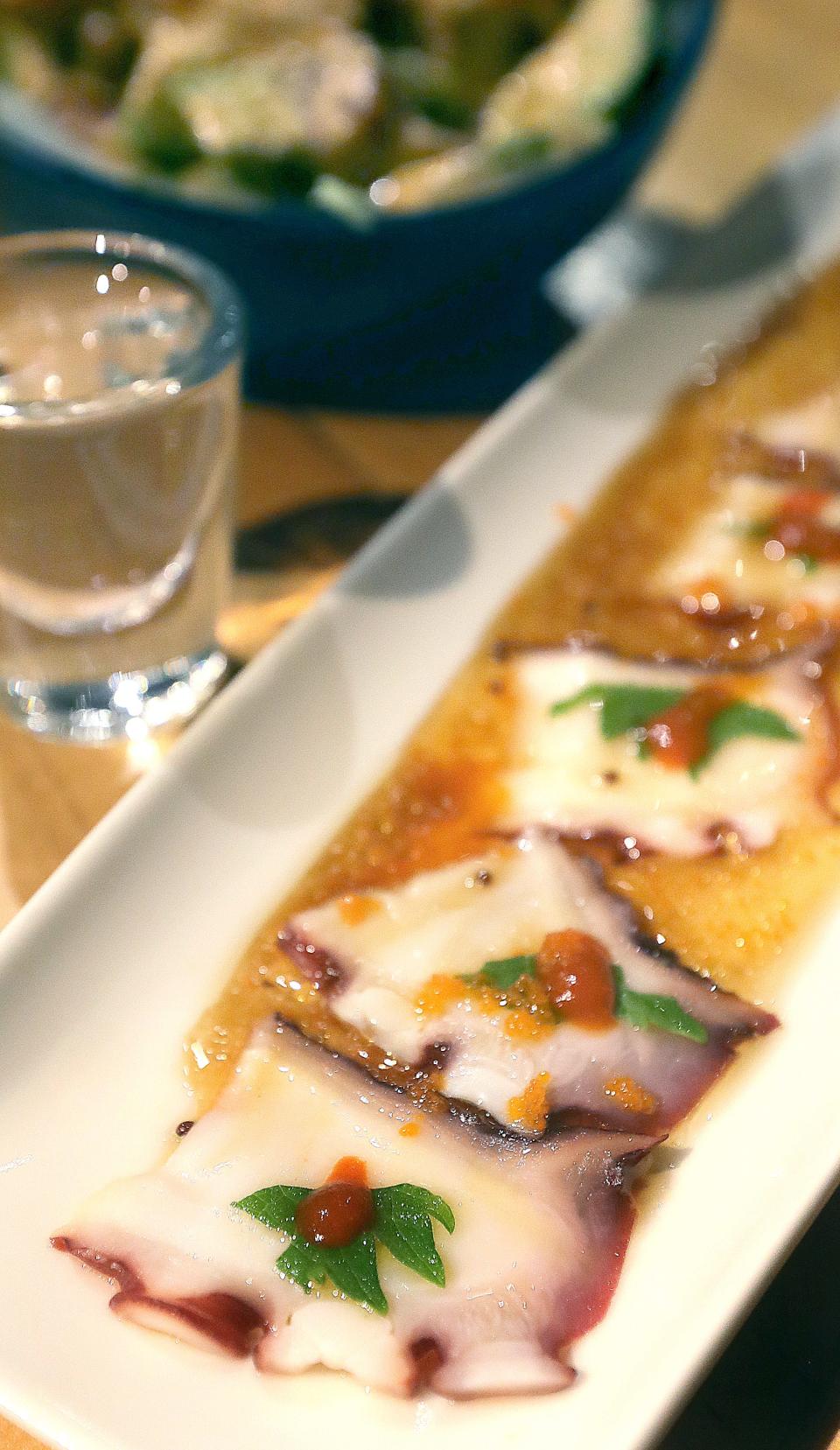 Thin slices of taka tiradido (octopus), warm sake and a spicy tuna bowl at Kasai in Green.