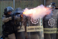 <p>A municipal guard fires tear gas at demonstrators during a protest against the state government in Rio de Janeiro, Brazil, Feb. 20, 2017. The protesters are denouncing a proposal to privatize the state’s water and sewage company. (AP Photo/Leo Correa) </p>