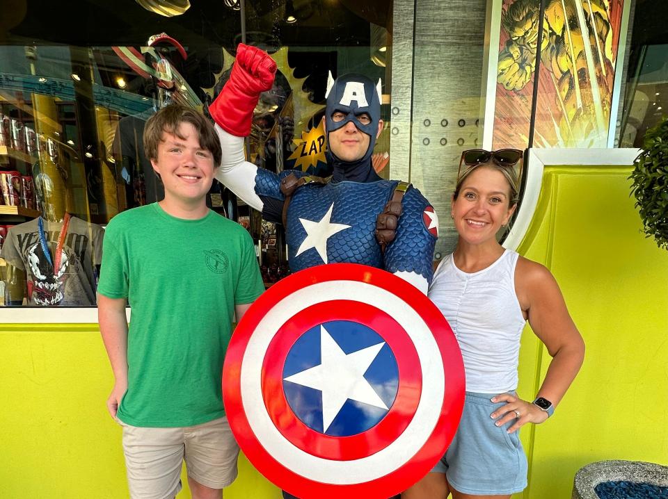 terri and her son posing with captain america at universal orlando