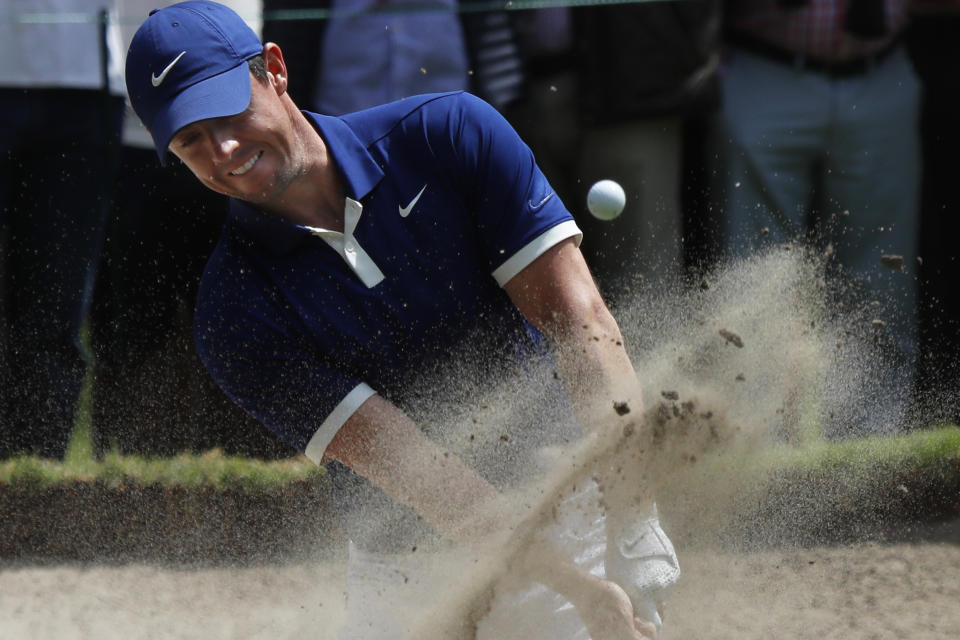 Rory Mcllroy hits the ball out of the sand trap on the 1st hole on the third round of competition of the WGC-Mexico Championship at the Chapultepec Golf Club in Mexico City, Saturday, Feb. 23, 2019. (AP Photo/Marco Ugarte)
