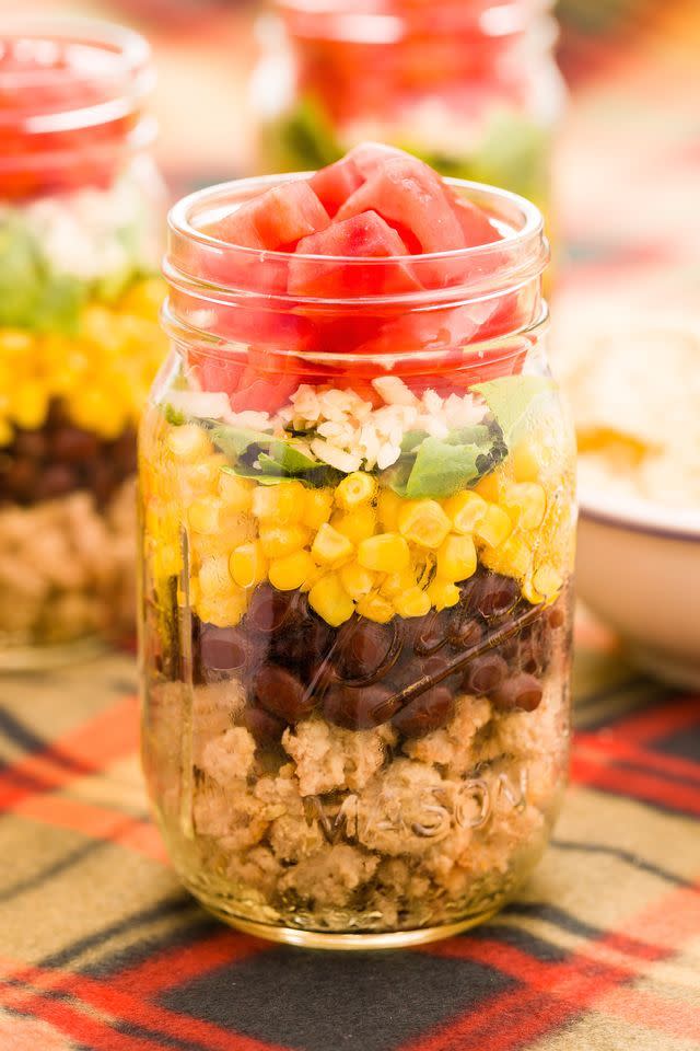 <p>Layers of turkey mince, black beans, corn, spring onions, cheese, and tomatoes is lunchtime goals. </p><p>Get the <a href="https://www.delish.com/uk/cooking/recipes/a29891198/taco-salad-in-a-jar-recipe/" rel="nofollow noopener" target="_blank" data-ylk="slk:Taco Salad Jar;elm:context_link;itc:0;sec:content-canvas" class="link ">Taco Salad Jar</a> recipe. </p>