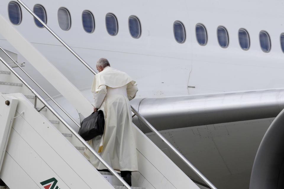 Pope Francis boards the airplane for Abu Dhabi, United Arab Emirates, at Rome's Fiumicino International airport, Sunday, Feb. 3, 2019. Francis made an urgent appeal for an end to the humanitarian crisis in Yemen on Sunday as he embarked on the first-ever papal trip to the Arabian Peninsula, where he is seeking to turn a page in Christian-Muslim relations while also ministering to a unique, thriving island of Catholicism. (AP Photo/Gregorio Borgia)