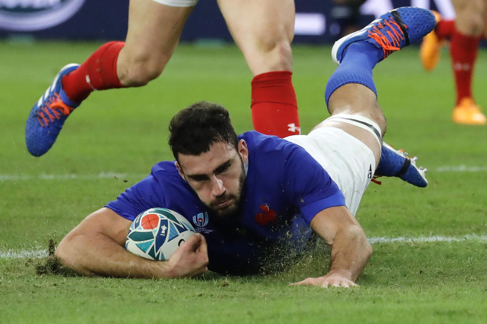 France's Charles Ollivon scores a try against Wales during the Rugby World Cup quarterfinal match at Oita Stadium in Oita, Japan, Sunday, Oct. 20, 2019. (AP Photo/Christophe Ena)