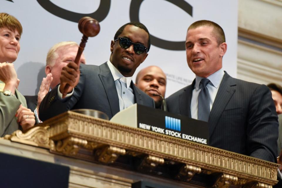 After standing beside Diddy to ring the closing bell, then-president of the NYSE Tom Farley (right) said Diddy was an inspiration and on a par with the Founding Fathers. Getty Images