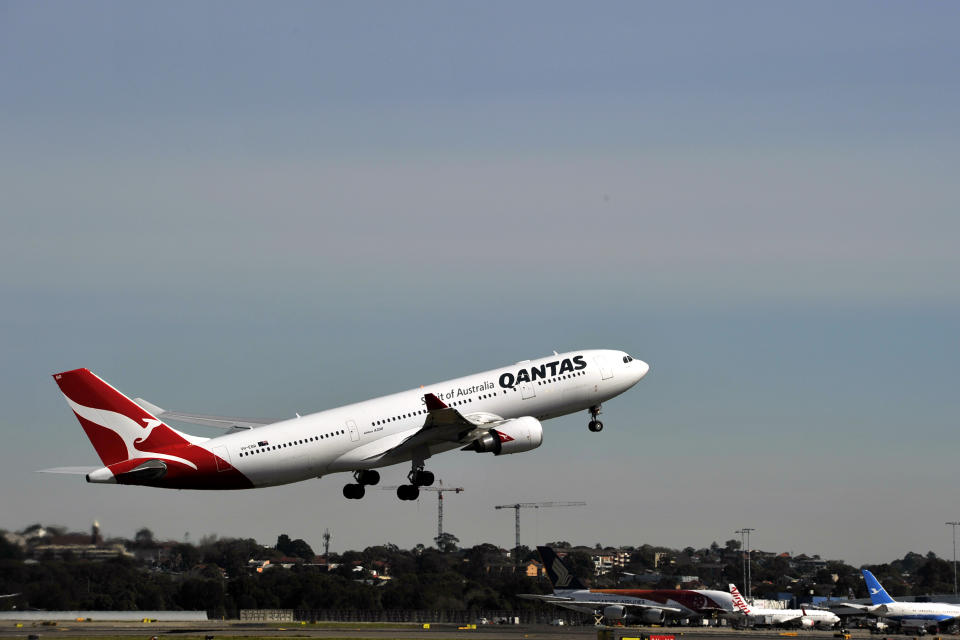 Qantas aircraft seen taking off at Sydney International Airport.