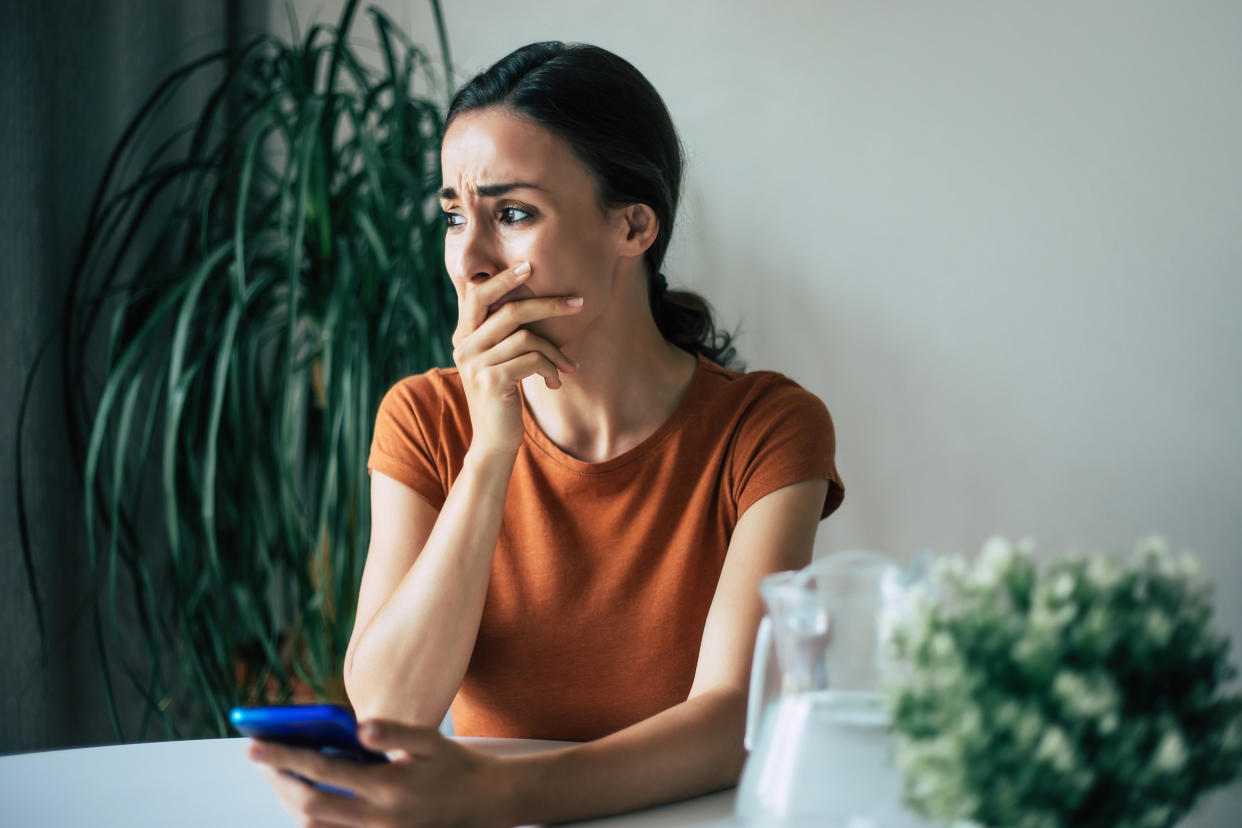 Reading a partner's private text messages or journal can be shameful, lonely behavior. For many, it's also something they can't quit. (Photo: Getty Images)