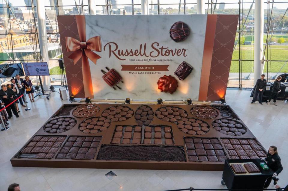 The last two giant slabs of chocolate are wheeled in on a cart to put inside a Russell Stover Chocolates box during the Kansas City-based chocolate company’s attempt to break the Guinness World Record for the largest box of chocolate Monday, April 17, 2023, at the Kauffman Center for the Performing Arts. More than 5,000 pounds of giant chocolate candies were loaded into the oversized gift box to set a new Guiness World Record of 5,616 pounds.