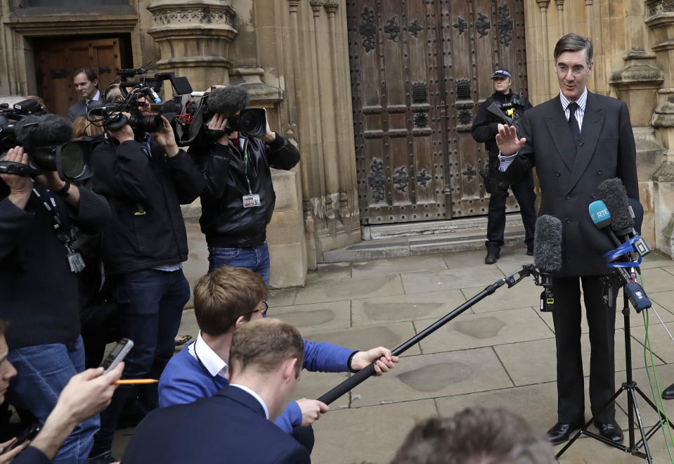 Pro-Brexit, Conservative lawmaker Jacob Rees-Mogg gestures as he speaks to the media outside the Houses of Parliament in London, Thursday, Nov. 15, 2018. A pro-Brexit group of Conservative lawmakers says one of its leaders, Jacob Rees-Mogg, is formally calling for a vote of no-confidence in Prime Minister Theresa May. Two British Cabinet ministers, including Brexit Secretary Dominic Raab, resigned Thursday in opposition to the divorce deal struck by Prime Minister Theresa May with the EU — a major blow to her authority and her ability to get the deal through Parliament.(AP Photo/Matt Dunham)