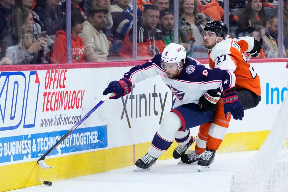 Columbus Blue Jackets' Ivan Provorov, left, tries to get past Philadelphia Flyers' Noah Cates during the second period of an NHL hockey game, Sunday, Nov. 19, 2023, in Philadelphia. (AP Photo/Matt Slocum)