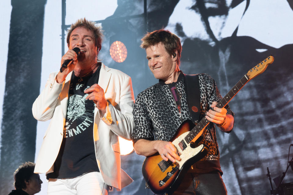 AUSTIN, TEXAS - OCTOBER 10: Singer Simon Le Bon (L) and touring guitarist Dominic Brown of Duran Duran perform live on stage during Austin City Limits Festival at Zilker Park on October 10, 2021 in Austin, Texas. (Photo by Jim Bennett/FilmMagic,)