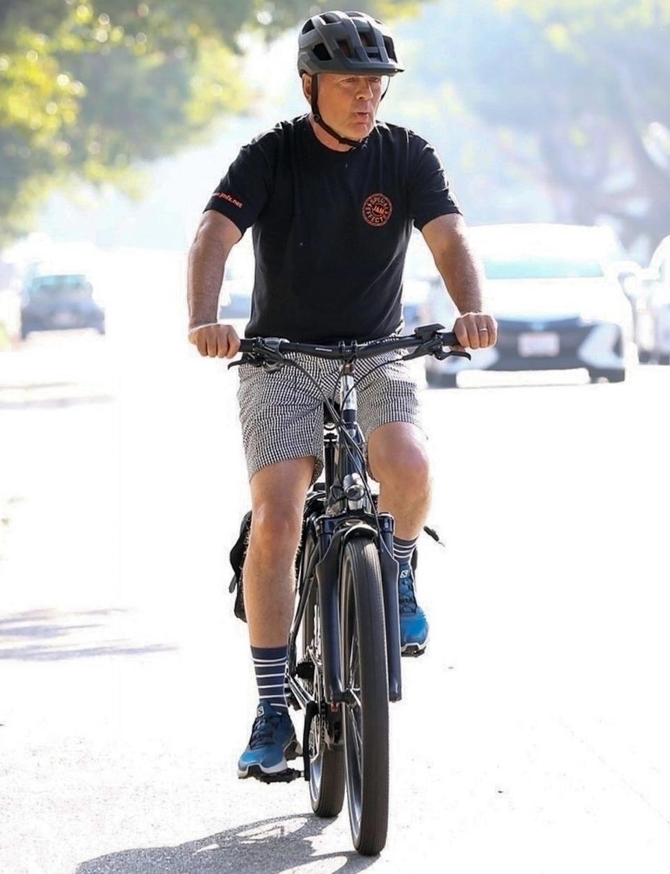 <p>Bruce Willis returns from quarantining in Idaho with his blended family and takes a bike ride through Brentwood, California, over the weekend. </p>