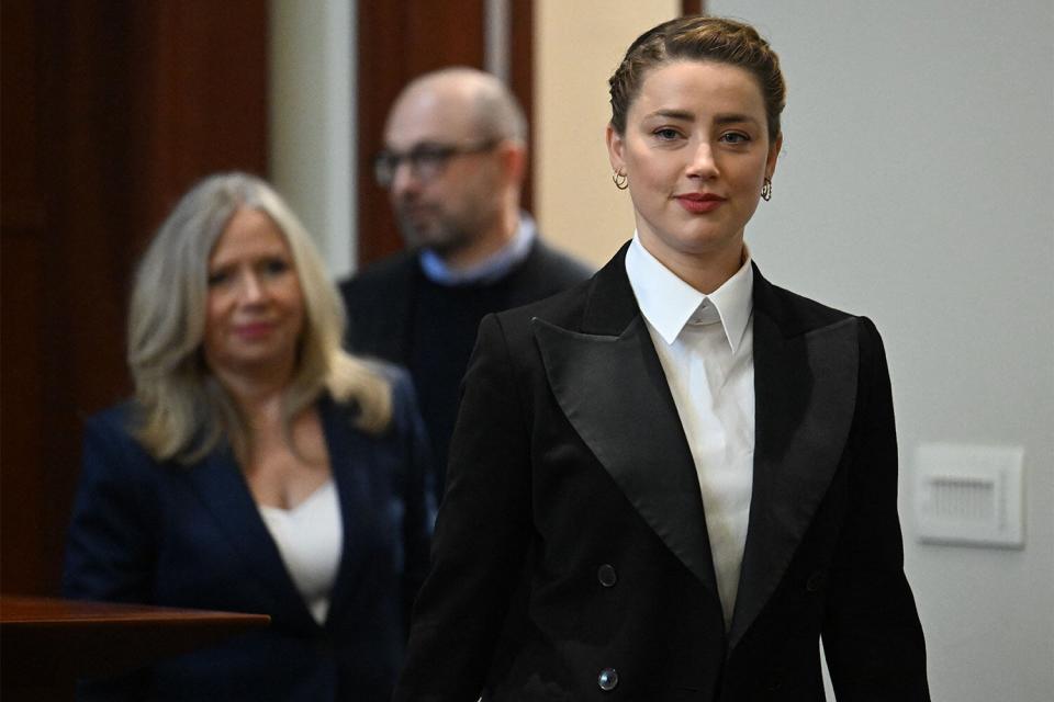 US actress Amber Heard arrives in the courtroom at the Fairfax County Circuit Court in Fairfax, Virginia, on May 3, 2022. - US actor Johnny Depp sued his ex-wife Amber Heard for libel in Fairfax County Circuit Court after she wrote an op-ed piece in The Washington Post in 2018 referring to herself as a "public figure representing domestic abuse." (Photo by JIM WATSON / POOL / AFP) (Photo by JIM WATSON/POOL/AFP via Getty Images)