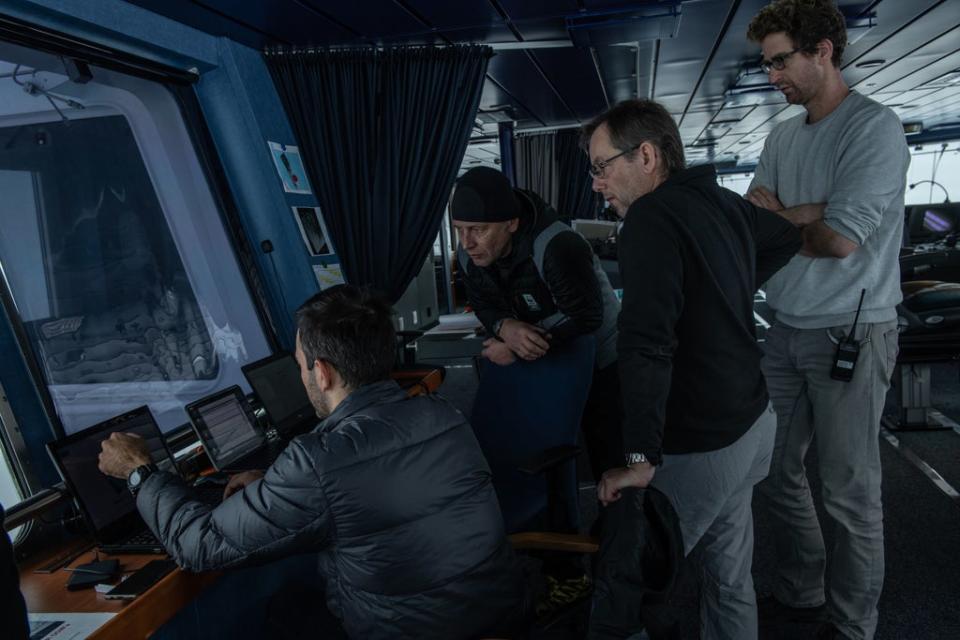 Lasse Rabenstein (right), the chief scientist on the bridge of S A Agulhas II, with other crew members during the expedition (PA)