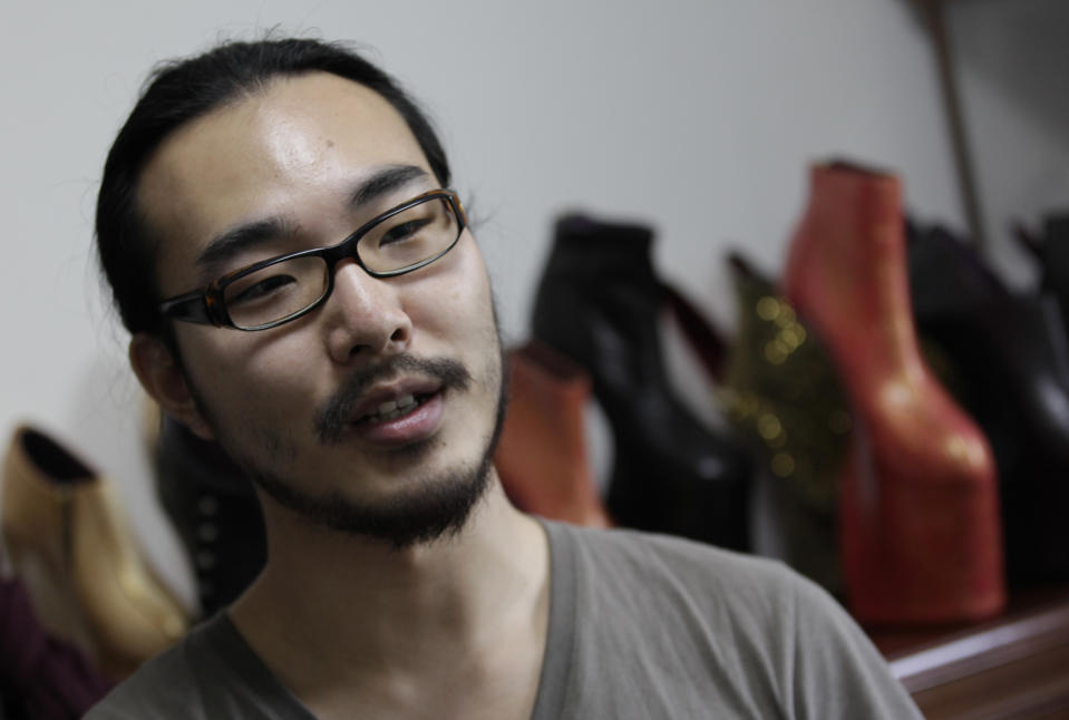 Japanese shoe designer Noritaka Tatehana speaks during an interview at his workplace in Tokyo, Tuesday, May 29, 2012. Tatehana has become a pop diva's favorite by taking geisha and making it Gaga. (AP Photo/Shizuo Kambayashi)