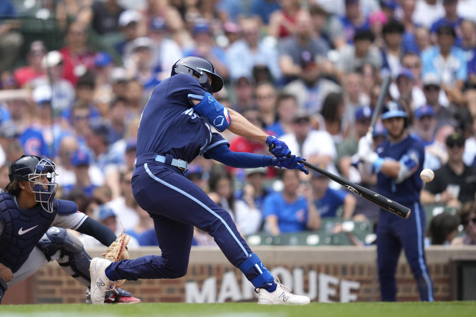 Chicago Cubs' Jared Young hits a two-run triple off Cleveland Guardians starting pitcher Cal Quantrill during the fourth inning of a baseball game Friday, June 30, 2023, in Chicago. (AP Photo/Charles Rex Arbogast)