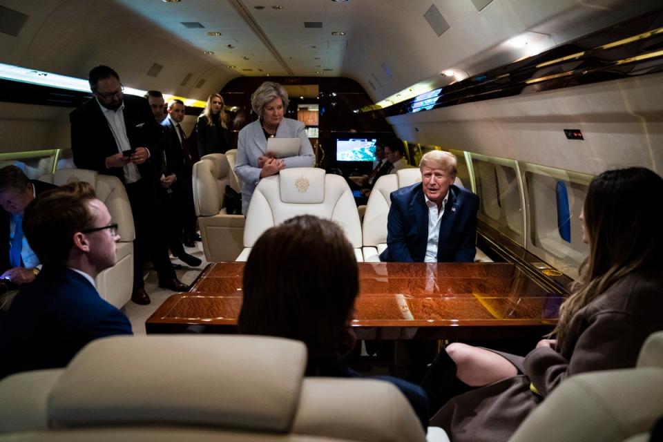 Trump talks strategy on a plane back from New Hampshire, with Wiles not too far away (The Washington Post/Getty)