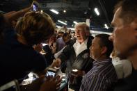 <p>President Donald Trump shakes hands and hands out flashlights and other supplies at Calvary Chapel, Tuesday, Oct. 3, 2017, in Guaynabo, Puerto Rico. (Photo: Evan Vucci/AP) </p>