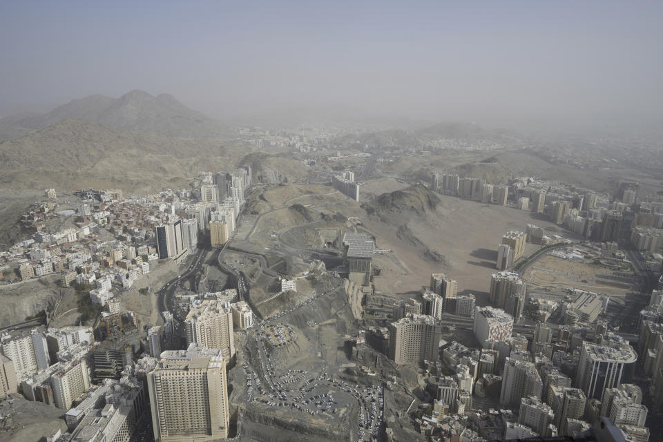 A general view shows the Muslim holy city of Mecca, Saudi Arabia, Sunday, June 25, 2023. Mecca is Islam's most sacred city and a focal point for the faith's followers. But it's also a place where around 2 million people live, work, and do everyday activities like laundry, grocery shopping, homework, putting the trash out, and paying the bills. Traffic, the population, and prices balloon during the peak Ramadan and Hajj seasons. (AP Photo/Amr Nabil)