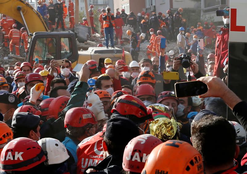 Rescue operations take place on a site after an earthquake struck the Aegean Sea, in the coastal province of Izmir