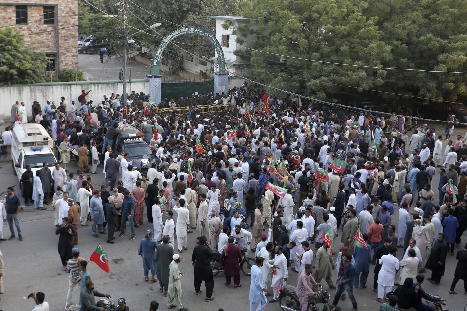Supporters of former Prime Minister Imran Khan's party hold a protest to condemn Election Commission's decision, in Karachi, Pakistan, Friday, Oct. 21, 2022. Pakistan's elections commission on Friday disqualified former Prime Minister Imran Khan from holding public office for five years, accusing him of unlawfully selling state gifts and concealing assets, his spokesman and officials said. The move is likely to deepen lingering political turmoil in the impoverished country. (AP Photo/Fareed Khan)