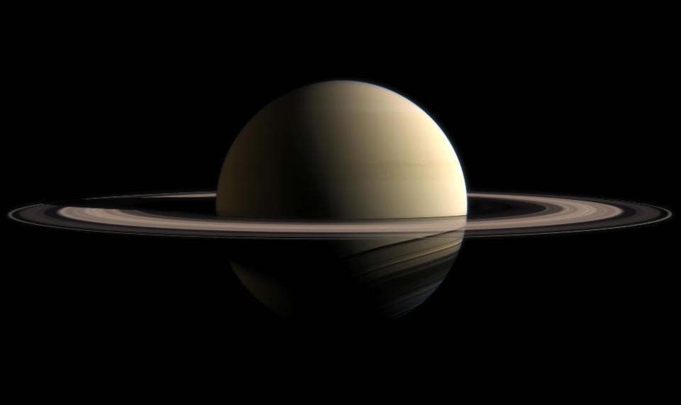 Close-Up Of Saturn Against Black Background