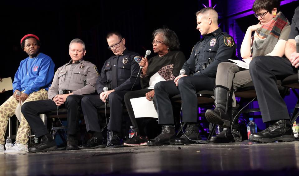Marilyn Luper-Hildreth speaks as police and community leaders meet during a forum on Sunday at Tower Theatre. Beside her are Wade Gourley, JD Younger and Todd Gibson.