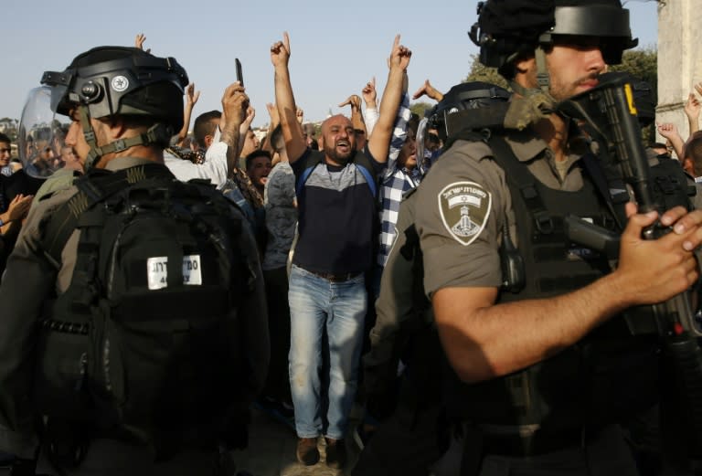 A Palestinian shouts slogans at Israeli police at Jerusalem's Al-Aqsa mosque compound as clashes break out after the ending of a two-week Muslim boycott on July 27, 2017