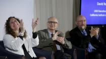(L-R) Doctors Gabriela Gonzalez, Rainer Weiss and Kip Thorne applaud the announcement of the detection of gravitational waves, ripples in space and time hypothesized by physicist Albert Einstein a century ago, in Washington February 11, 2016. REUTERS/Gary Cameron