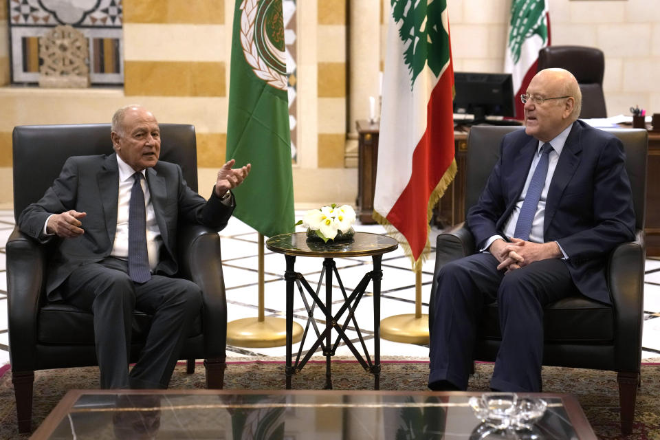 Arab League Secretary-General Ahmed Aboul Gheit, left, meets with Lebanese Prime Minister Najib Mikati, in Beirut, Lebanon, Monday, March 14, 2022. (AP Photo/Hussein Malla)