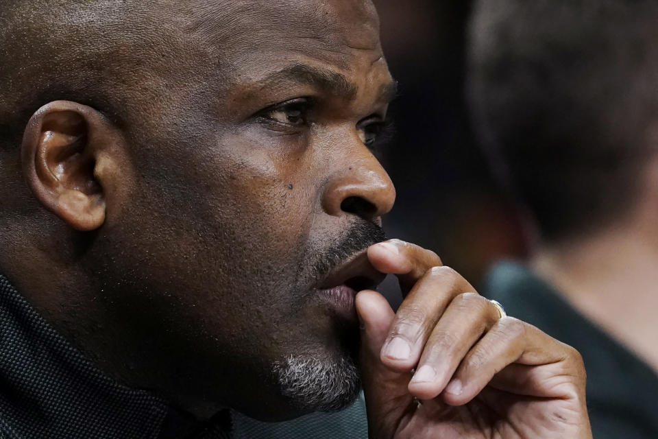 Atlanta Hawks coach Nate McMillan watches from the bench during the first half of the team's NBA basketball game against the Brooklyn Nets on Friday, Dec. 10, 2021, in Atlanta. (AP Photo/John Bazemore)