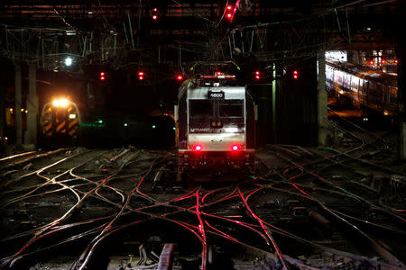 Commuter trains travel inside New York's Penn Station, the nation's busiest train hub, on a section of a complex of tracks that Amtrak says they will begin repairing over the summer in New York City, U.S., May 25, 2017. REUTERS/Mike Segar/gk