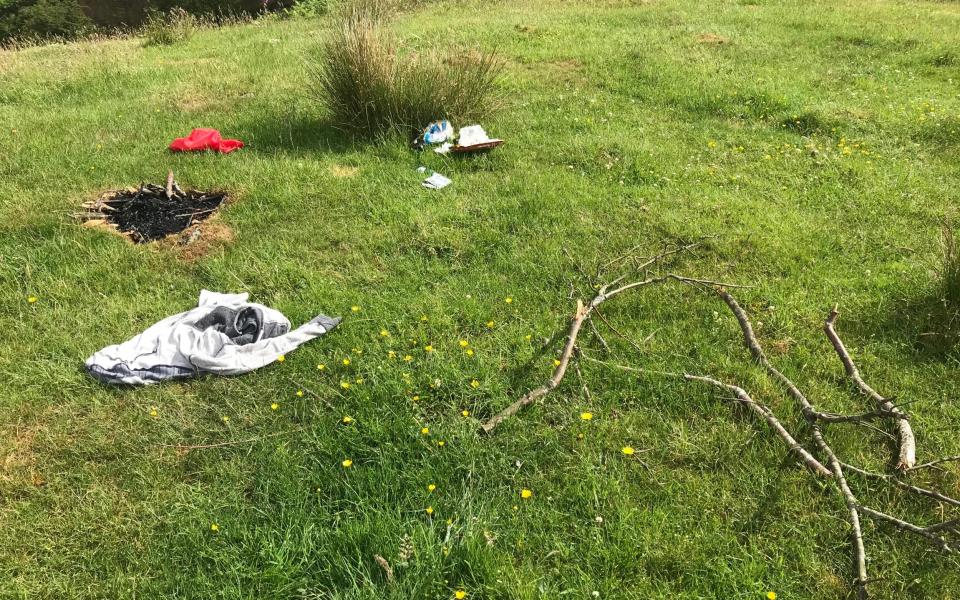 Fire pits, discarded clothing and litter have been left behind in the Lake District - Stuart Nicol Photography