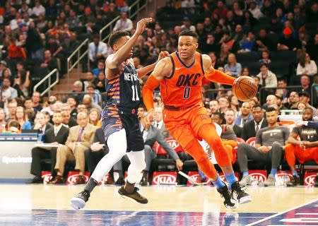 Jan 21, 2019; New York, NY, USA; Oklahoma City Thunder guard Russell Westbrook (0) dribbles the ball against New York Knicks guard Frank Ntilikina (11) during the first half at Madison Square Garden. Mandatory Credit: Andy Marlin-USA TODAY Sports