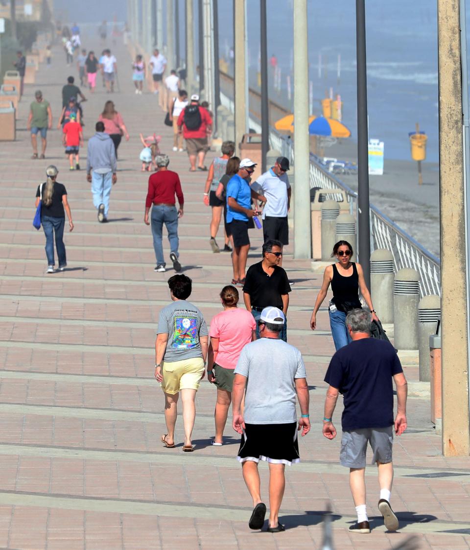 Visitors stroll the landmark Daytona Beach Boardwalk on a recent sunny afternoon. After two record-setting years, 2023 was a reset year for Volusia tourism as more travel options opened for potential visitors worldwide.