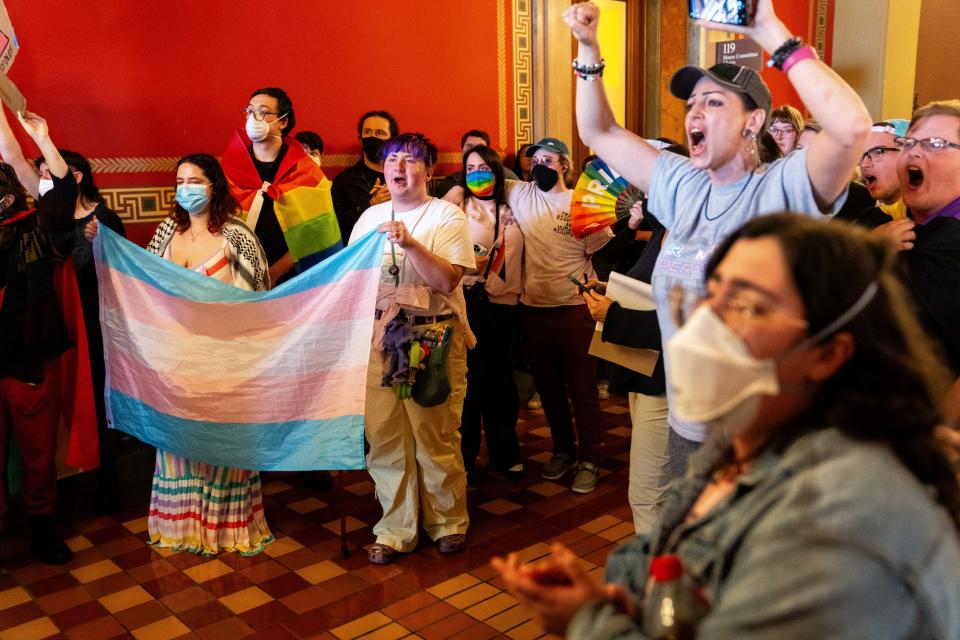 Protesters stand outside the chamber doors as they shout in opposition to HSB 649 Tuesday, Feb. 6, 2024, at the Iowa State Capitol. The bill would set legal definitions for the words, "sex," "man" and "women" into state law.