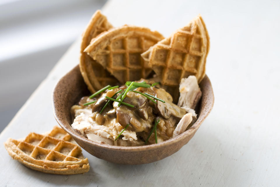 In this image taken on December 3, 2012, rotisserie chicken with waffles and gravy is seen served in a bowl in Concord, N.H. (AP Photo/Matthew Mead)