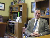 FILE - In this Jan. 14, 2014, file photo, Wyoming State Treasurer Mark Gordon sits in his office in the State Capitol in Cheyenne, Wyo. Gordon is among those seeking the Republican nomination to succeed Gov. Matt Mead. The winner in the Republican primary on Tuesday, Aug. 21, 2018, will likely meet Democratic former state Rep. Mary Throne, of Cheyenne, in November. Throne faces three little-known opponents in the Democratic primary. (AP Photo/Ben Neary, File)