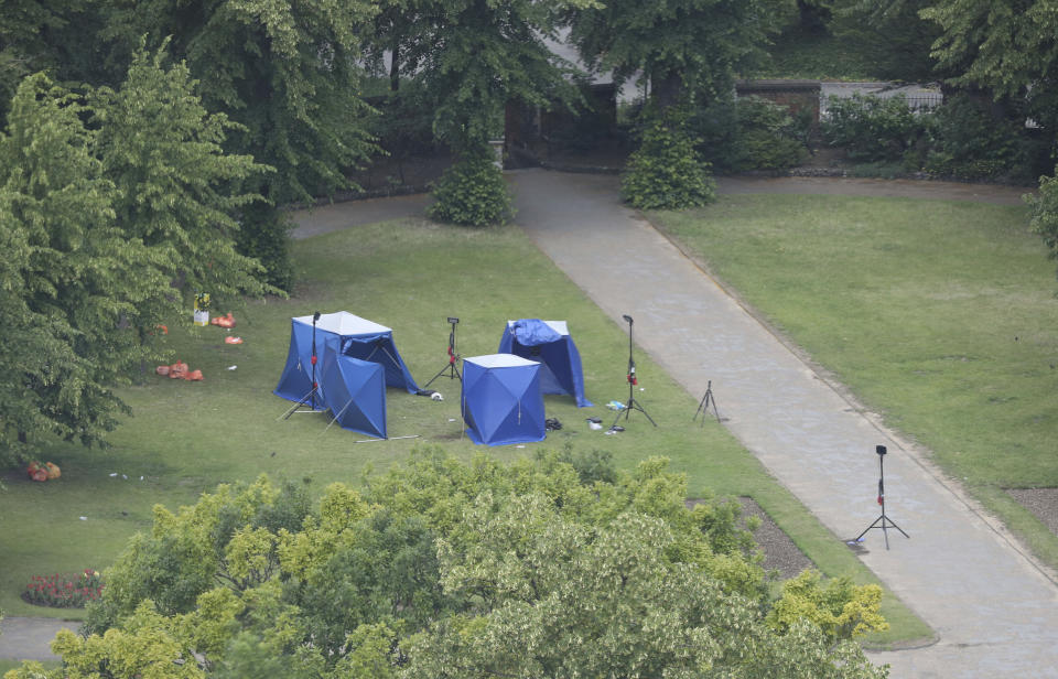 An aerial view showing police tents in Forbury Gardens at the scene of a multiple stabbing attack which took place on Saturday, in Reading, England, Sunday June 21, 2020. Police say a stabbing rampage in Britain that killed three people as they sat in a park on a summer evening is being considered a terrorist attack. A 25-year-old man believed to be the lone attacker is in custody. (Jonathan Brady/PA via AP)