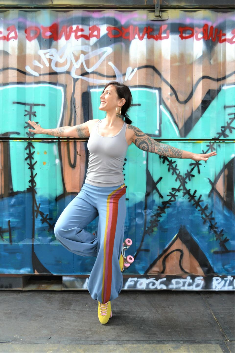 This photo provided by Ruby Amsen shows Amsen modeling the 1970s-influenced skater pants she hand makes in her Amsterdam, Netherlands, home. Amsen sells her skater wear at her Etsy.com shop, RewBdesigned. (Dakota Amsen/Ruby Amsen via AP)