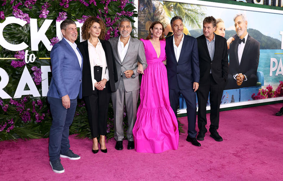 Jeff Shell, CEO, NBCUniversal, Donna Langley, Chairman, Universal Filmed Entertainment Group, George Clooney, Julia Roberts, Ol Parker, Tim Bevan attend the premiere of Universal Pictures' "Ticket To Paradise" at Regency Village Theatre on October 17, 2022 in Los Angeles, California.