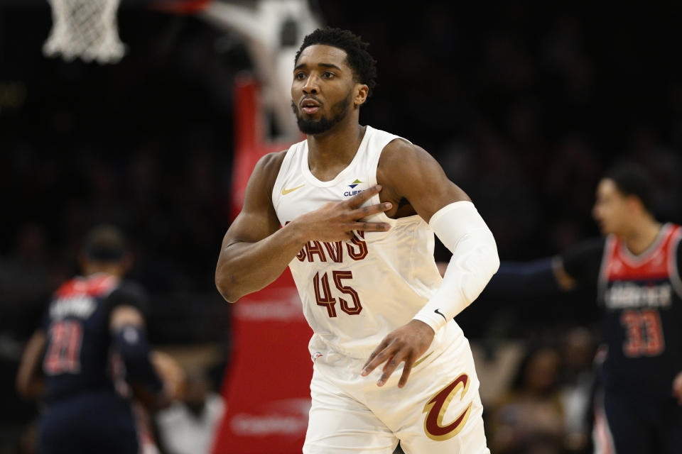 Cleveland Cavaliers guard Donovan Mitchell gestures after he made a 3-point basket against the Washington Wizards during the first half of an NBA basketball game Wednesday, Feb 7, 2024, in Washington. (AP Photo/Nick Wass)