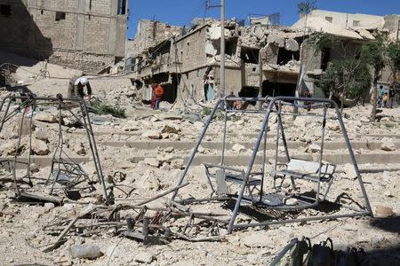 Swings are seen in a damaged site after airstrikes on the rebel held Tariq al-Bab neighbourhood of Aleppo, Syria September 24, 2016. REUTERS/Abdalrhman Ismail