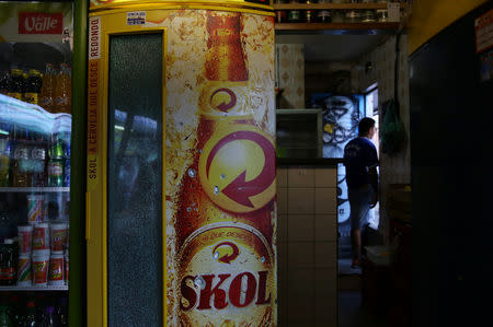 A refrigerator with bullet marks stands in Gulli's Cafe at Jacarezinho slum in Rio de Janeiro, Brazil, January 10, 2018. REUTERS/Pilar Olivares