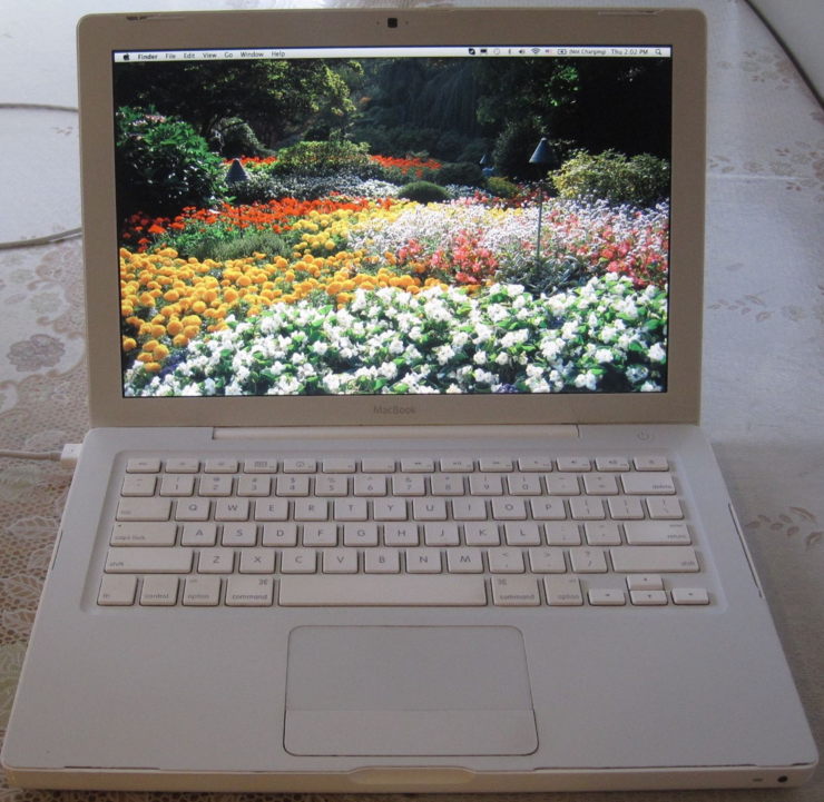 Open Macbook with flower field desktop wallpaper