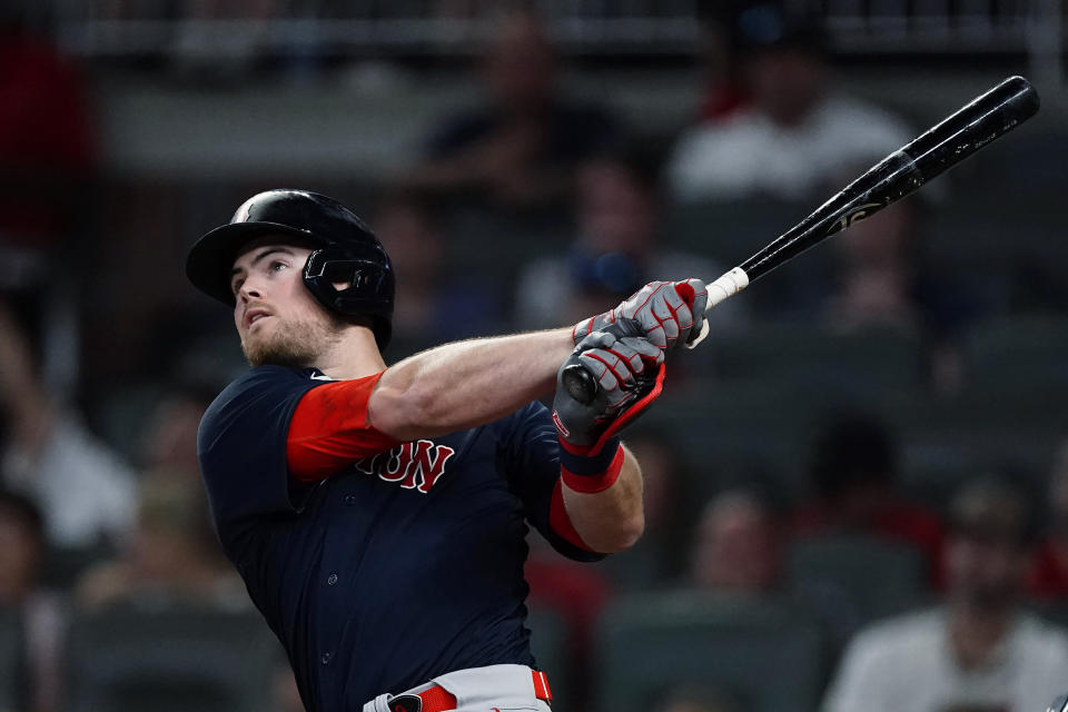 Boston Red Sox pinch-hitter Christian Arroyo follows through on a grand slam in the seventh inning of the team's baseball game against the Atlanta Braves on Wednesday, June 16, 2021, in Atlanta. (AP Photo/John Bazemore)