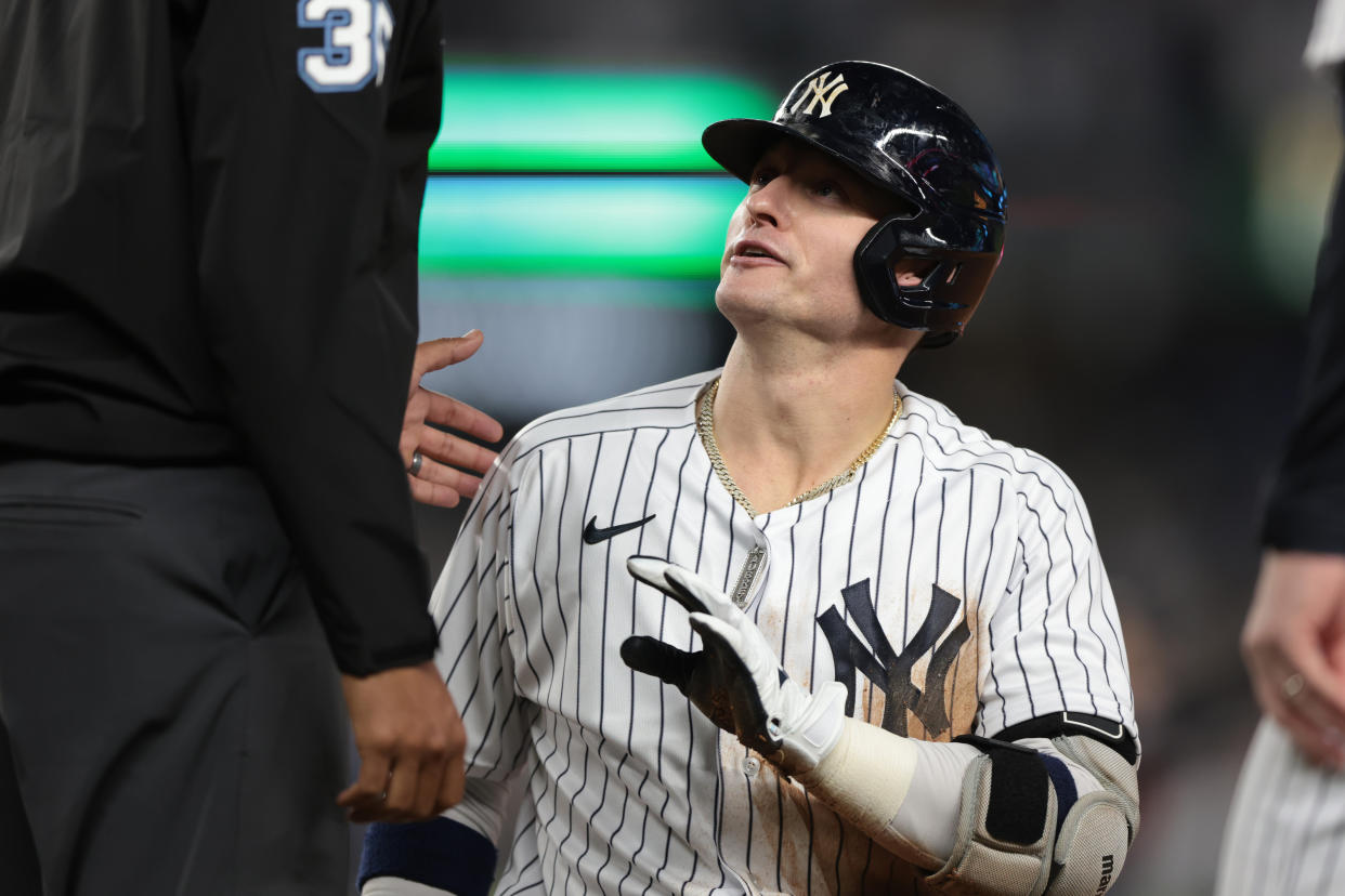 Oct 11, 2022; Bronx, New York, USA; New York Yankees third baseman Josh Donaldson (28) talks with 
umpire Jeremie Rehak (35) after being called out at first base during the fifth inning against the Cleveland Guardians in game one of the ALDS for the 2022 MLB Playoffs at Yankee Stadium. Mandatory Credit: Vincent Carchietta-USA TODAY Sports