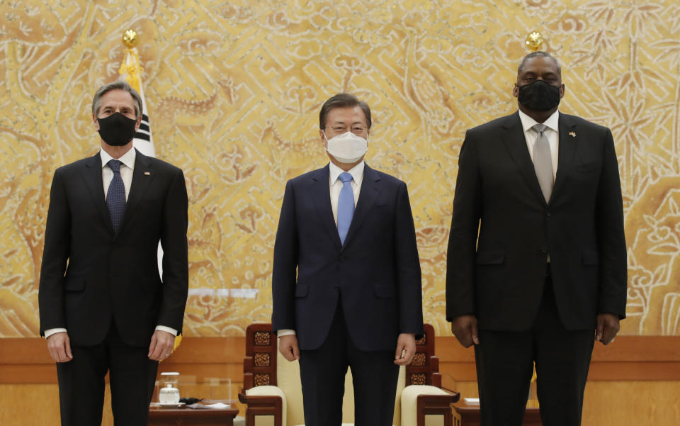 South Korean President Moon Jae-in, center, stands with U.S. Secretary of State Antony Blinken, left, and U.S. Defense Secretary Lloyd Austin as they pose for a photograph before their meeting at the presidential Blue House in Seoul, South Korea, Thursday, March 18, 2021. (AP Photo/Lee Jin-man, Pool)
