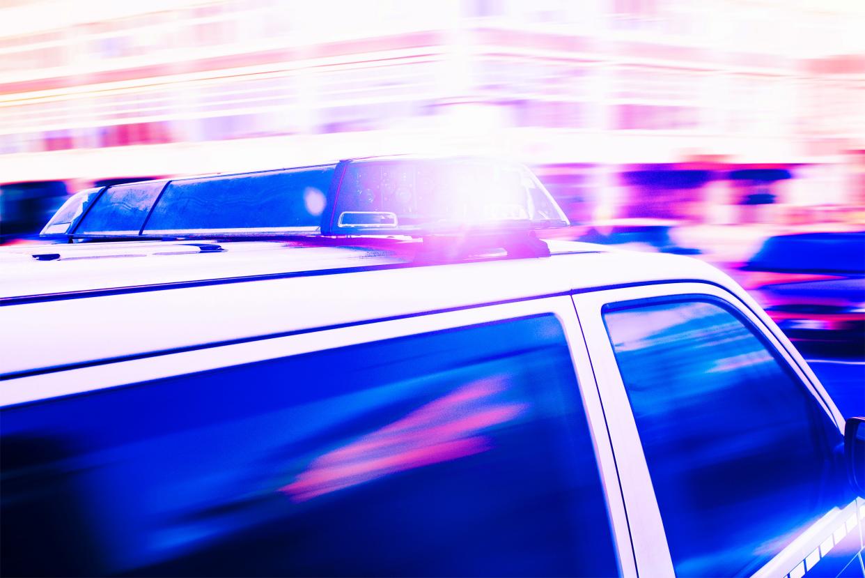 close-up of flashing blue lights on police car